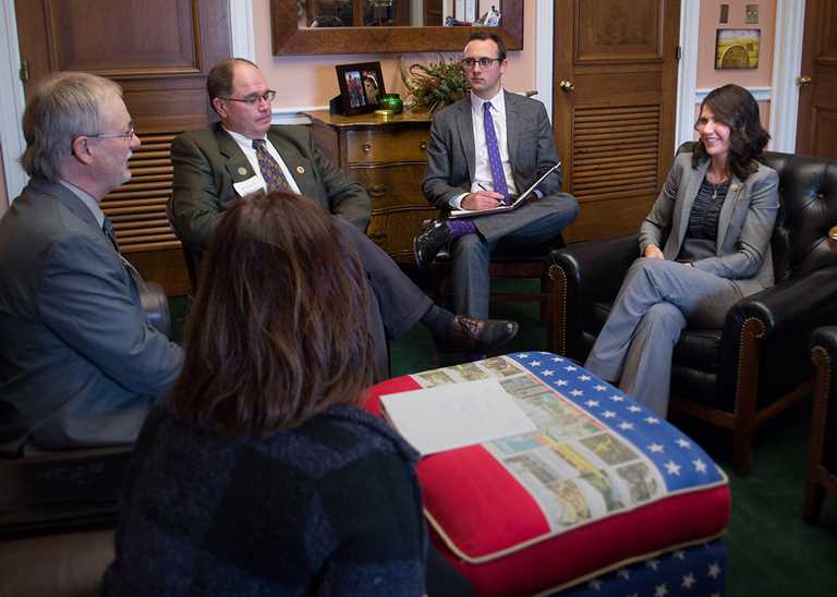 From left, SD Chair Harold Bickner and volunteer Bill Marketon meet with Rep. Kristi Noem (far right) on SD conservation issues. 
