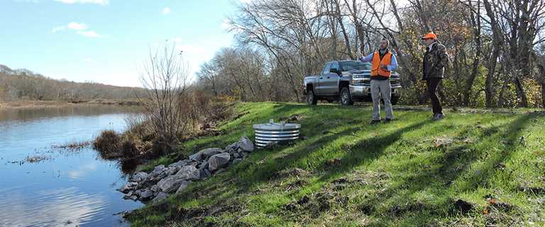 Rhode Island Department of Environmental Management staff inspect enhanced infrastructure at Great Swamp Management Area.
