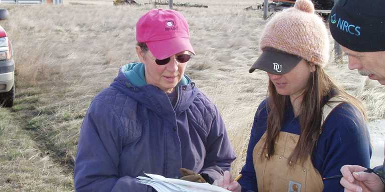 Ducks Unlimited Biologist Abby Dresser goes over a conservation program with a Montana producer. 