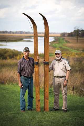 George Olson (left) and Don Jago with the marsh skis they used to reach remote and otherwise inaccessible hunting locations within the marsh.